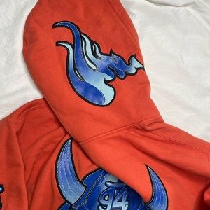 Large Supreme jacket (rustic orange with blue patches)